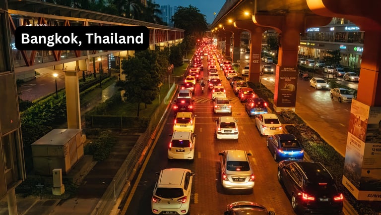 Evening traffic congestion in Bangkok Thailand with illuminated elevated highway and modern building