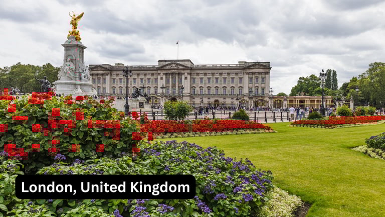 A wide, eye-level view of Buckingham Palace in London, United Kingdom, seen from across the Queen Vi