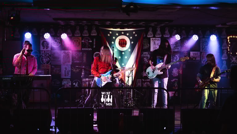 The five members of Hywater playing their instruments on stage