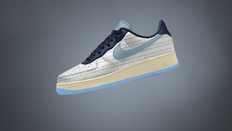 Free Nike Sneaker mockup with side view of patterned design, soft blue swoosh, and cream sole on gra