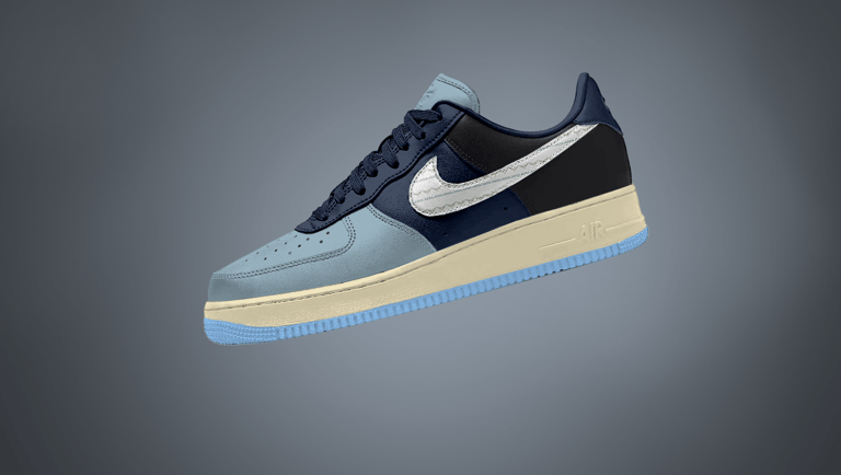 Free Nike Sneaker mockup showcasing left side view in navy, powder blue, and black color-block desig