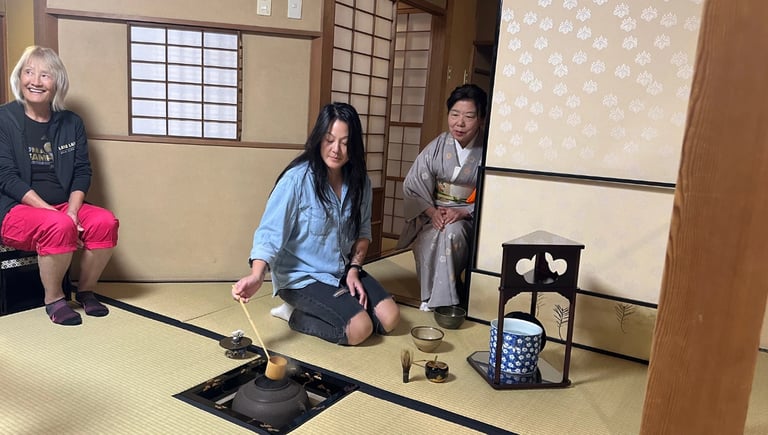 Foreign guests making matcha during a tea ceremony experience in Nagasaki