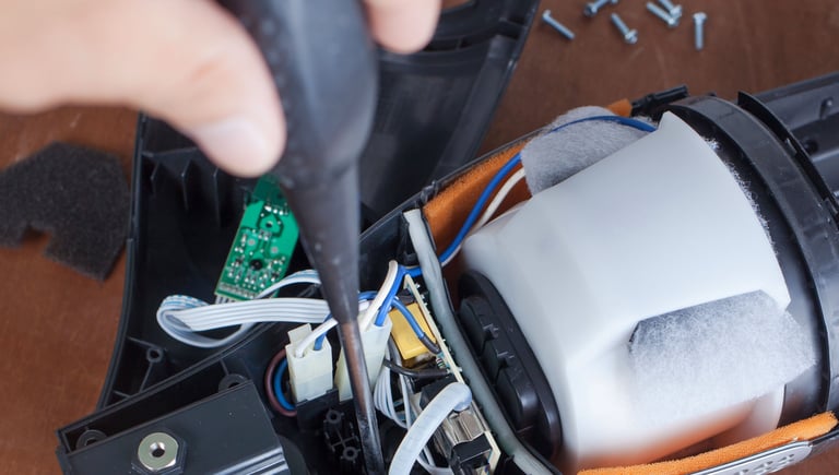 a person holding a remote control system in their hand