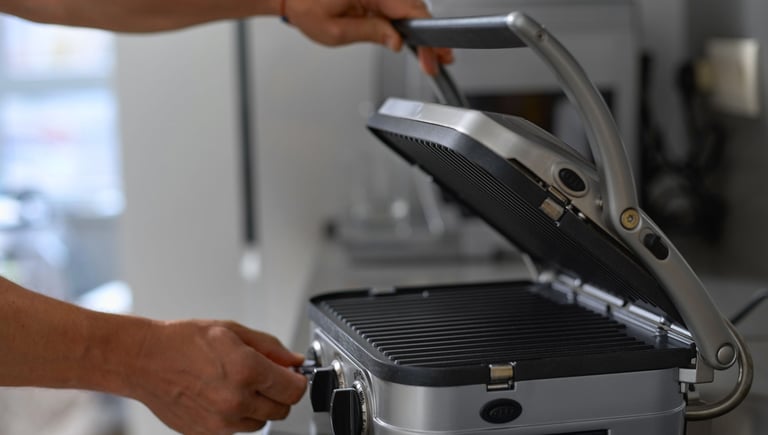 a person is holding a grill grill on a grill