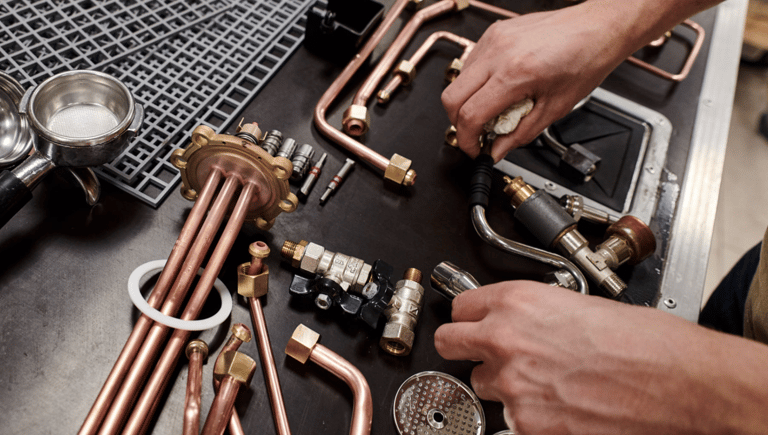 a man working on a copper pipework