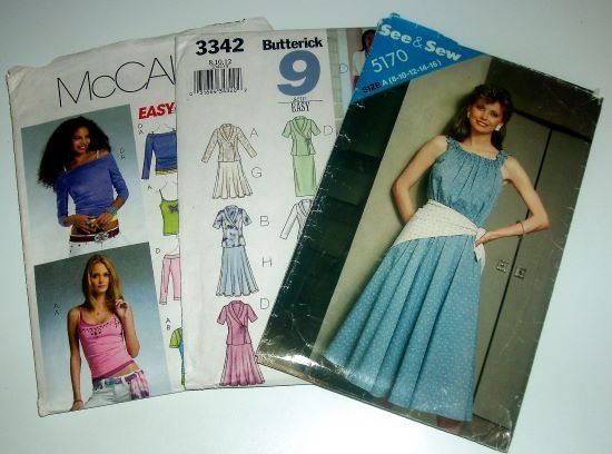 "Assorted vintage and contemporary sewing patterns including McCall's, Butterick, and See & Sew desi