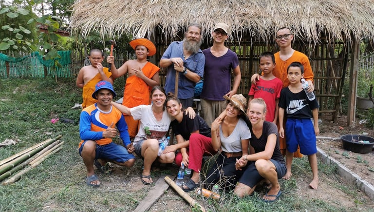 Group of Volunteers and Monks Helping at the Orphanage