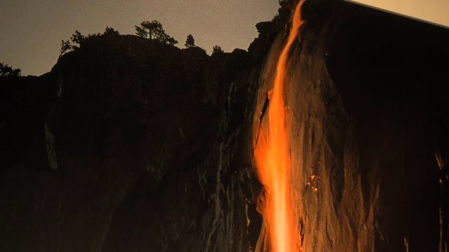 a waterfall flowing down a cliff face