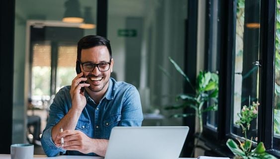 Happy business owner enjoying his time