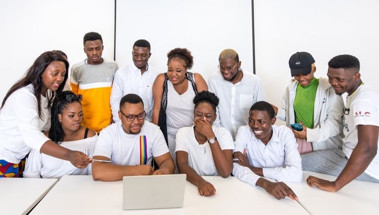 a group of people standing around a table