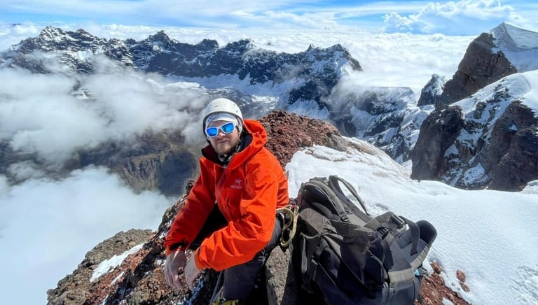 climber on top of El Altar Obispo