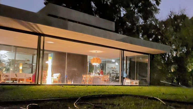 a house with a pond and a pond in the foreground