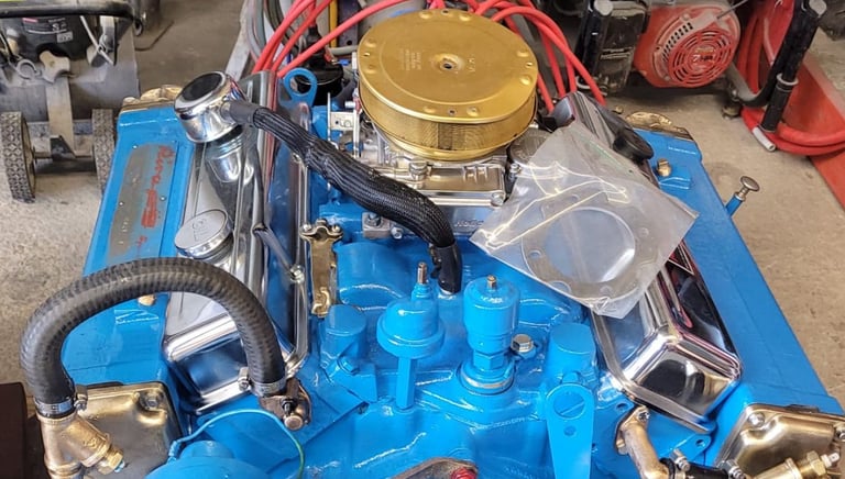 a blue engine with a gold top and a gold top