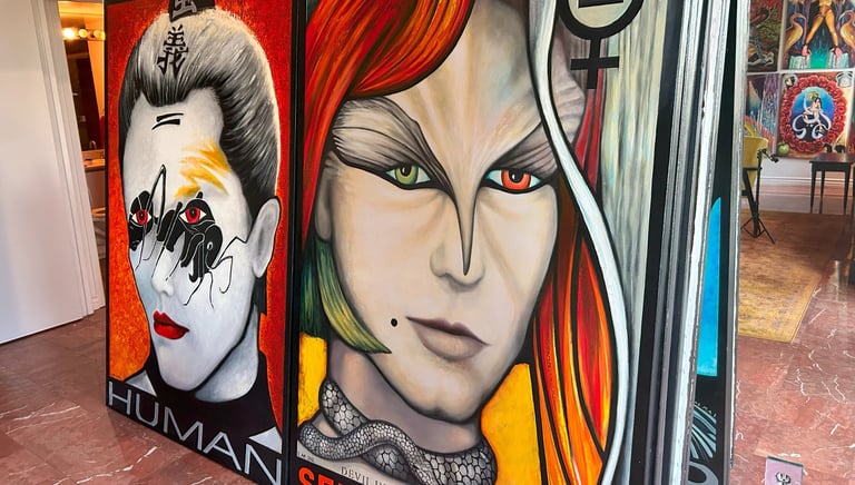 a large painting of a woman with red hair and a man with a white shirt