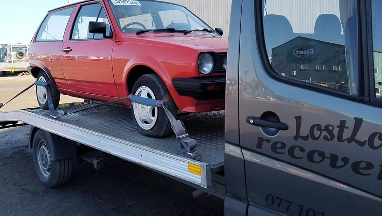 car collected from auction on recovery truck