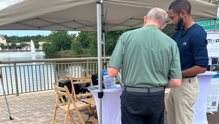 a man and a consultant standing in front of a tent