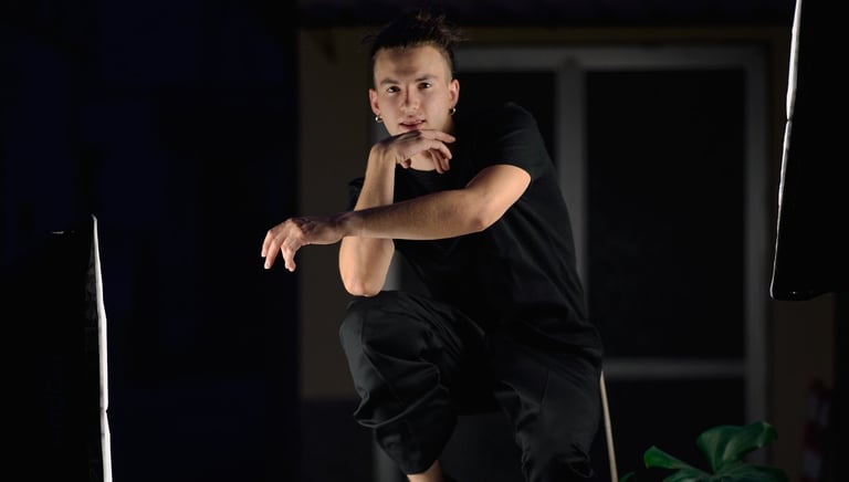 a man in black shirt jumping in the air