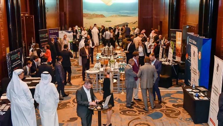 Event Photography - a group of people standing around a table with a laptop