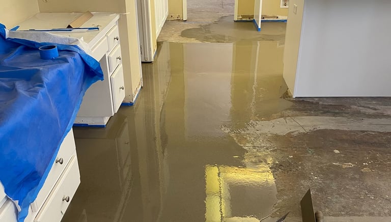 a kitchen floor with a blue tarp and a blue tarp
