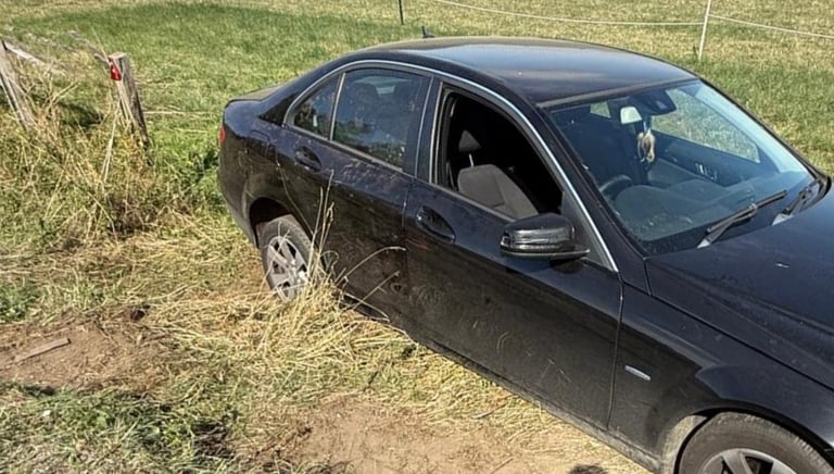 a car that is stuck in ditch being winched out