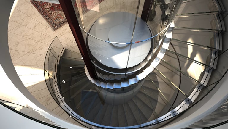 Staklena ograda spiralnog stepeništa napravljena od zakrivljenog stakla koje prati oblik stepenica