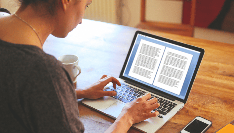 A woman editing a document on a laptop