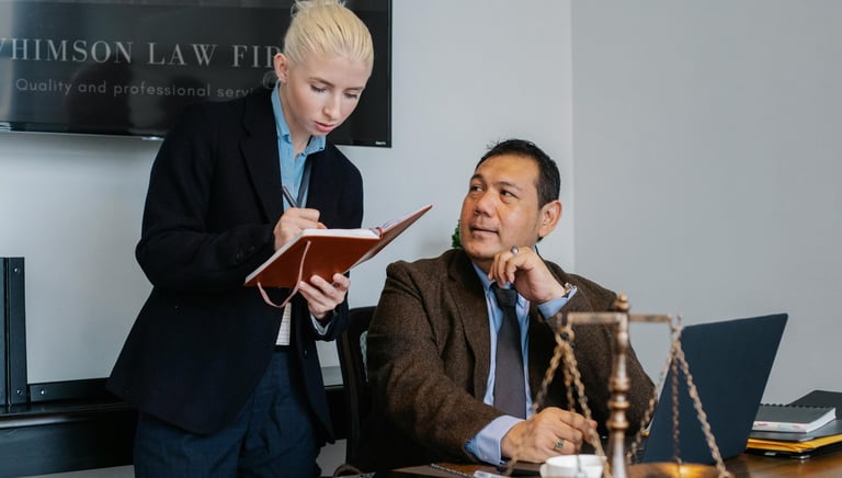 An assistant taking orders from her Boss