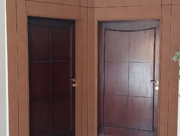 a room with a door and a door with a door handle