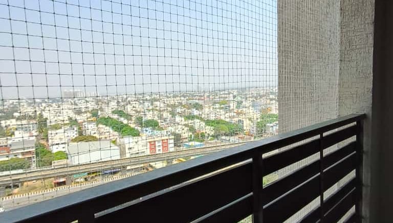 Close-up of a safety net being inspected for wear and tear