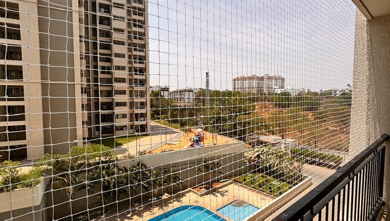 Close-up of a sturdy balcony safety net stretched tightly against the railing.