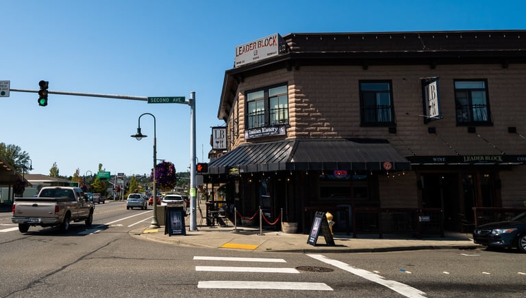 Leader Block Wine Co. and Italian Eatery restaurant building on a sunny street corner in Ferndale.