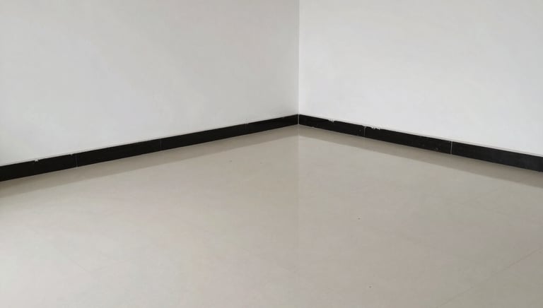 Professional cleaner using equipment to remove dust and debris from a newly constructed interior space.