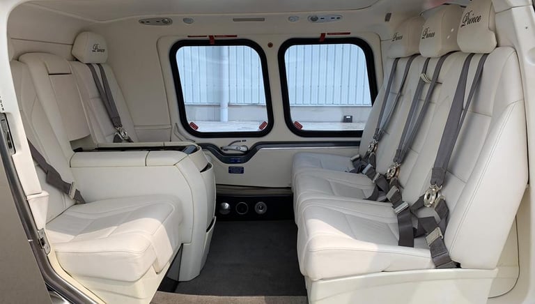Luxurious VIP interior of AW109 Grand helicopter with premium seating and advanced features.