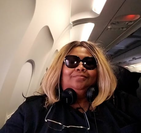 Iolande V Argent on a plane