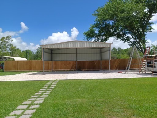 A metal carport structure under construction.