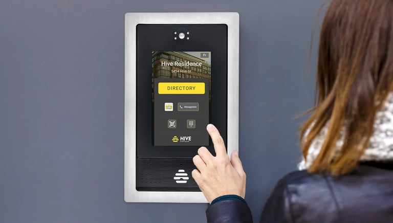 a woman is pressing a button on a touchscreen