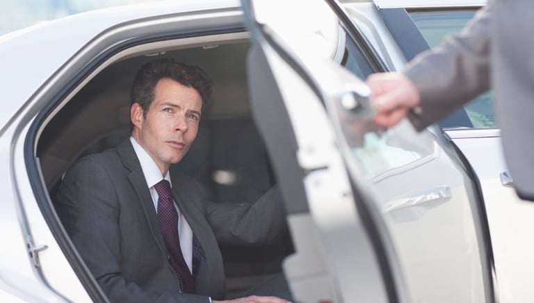 Executive is in a car