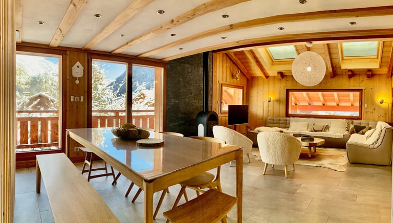 a dining room with a table and chairs