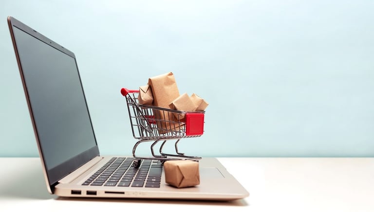 Small Cart Full of Gifts on Laptop Keyboard
