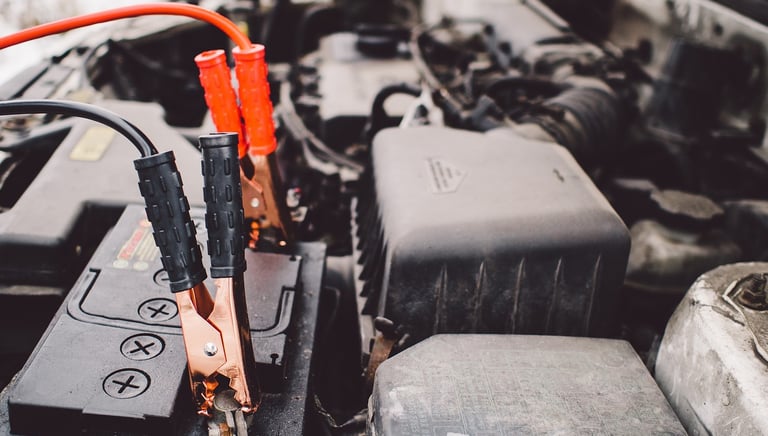 a car battery charger jump starting a car battery