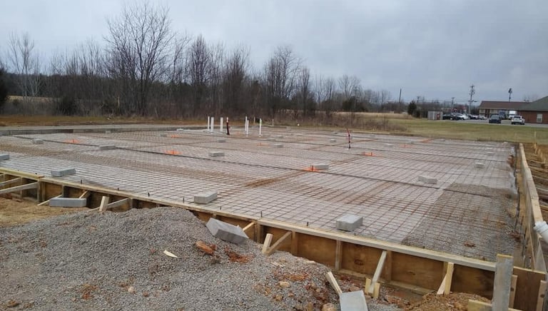 a large concrete slab being built into a foundation