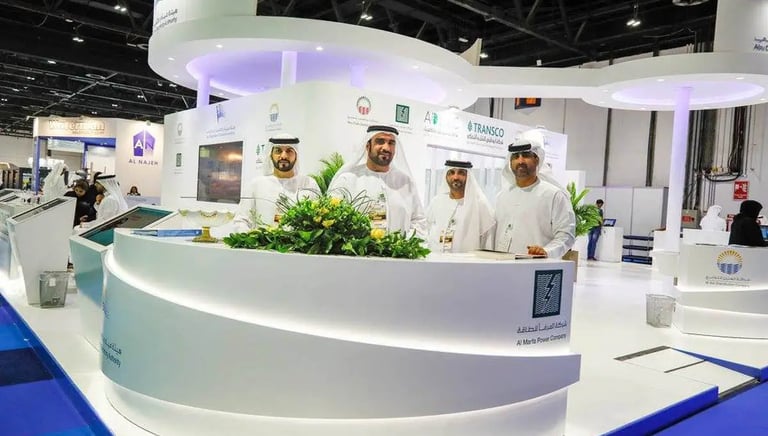 Event Photogrphy Dubai - a group of men standing in front of a large white counter