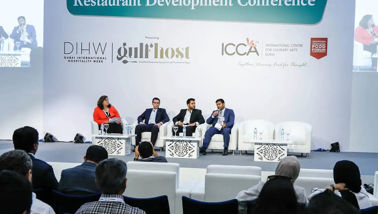 a group of people sitting in chairs at a conference