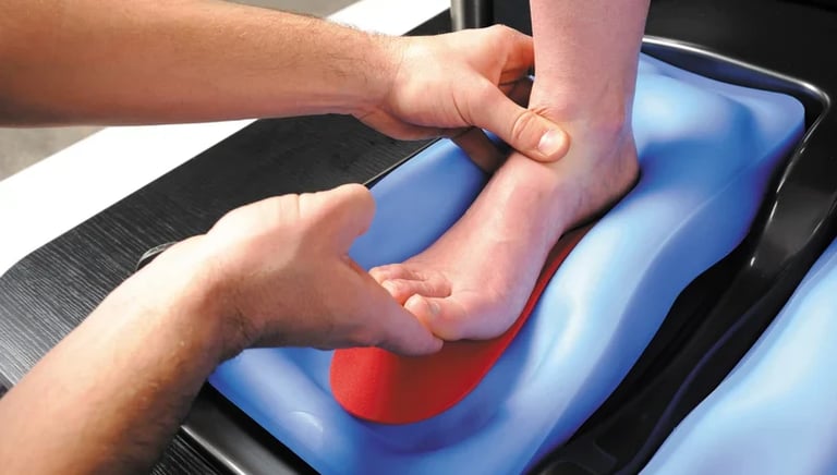 Close-up of a bike fitter forming custom insoles