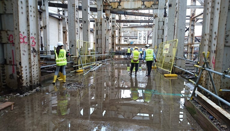 Construction site with workers and equipment