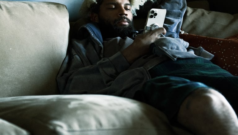 Commercial video production company: man lying on a couch with a book