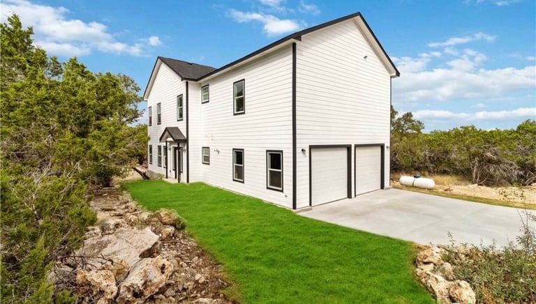 Custom home in Wimberley, Texas with solar panels and large backyard