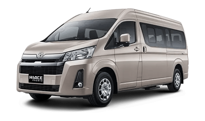 Gambar Toyota Hiace Premio warna beige pintu geser menggunakan velg Aloy pandangan dari kiri depan.