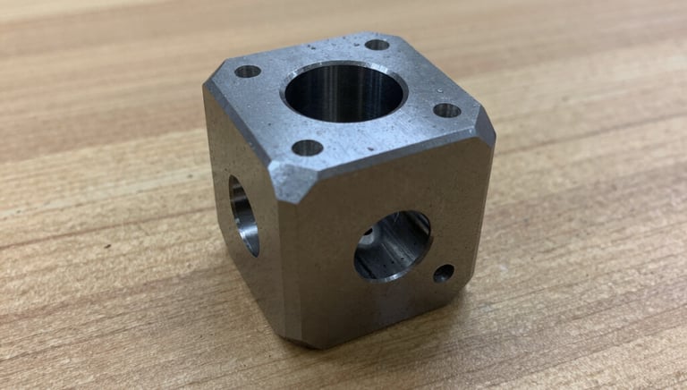 Close-up of a CNC machine shaping a metal part with precision.