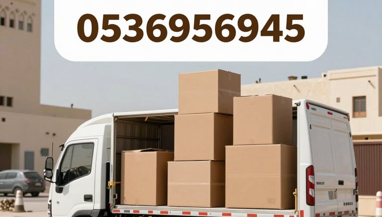 A professional team carefully loading furniture into a moving truck in Riyadh.